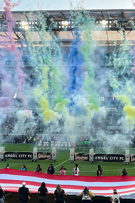 rainbow smoke rises over the field at Banc of California for Angel City's first Pride night